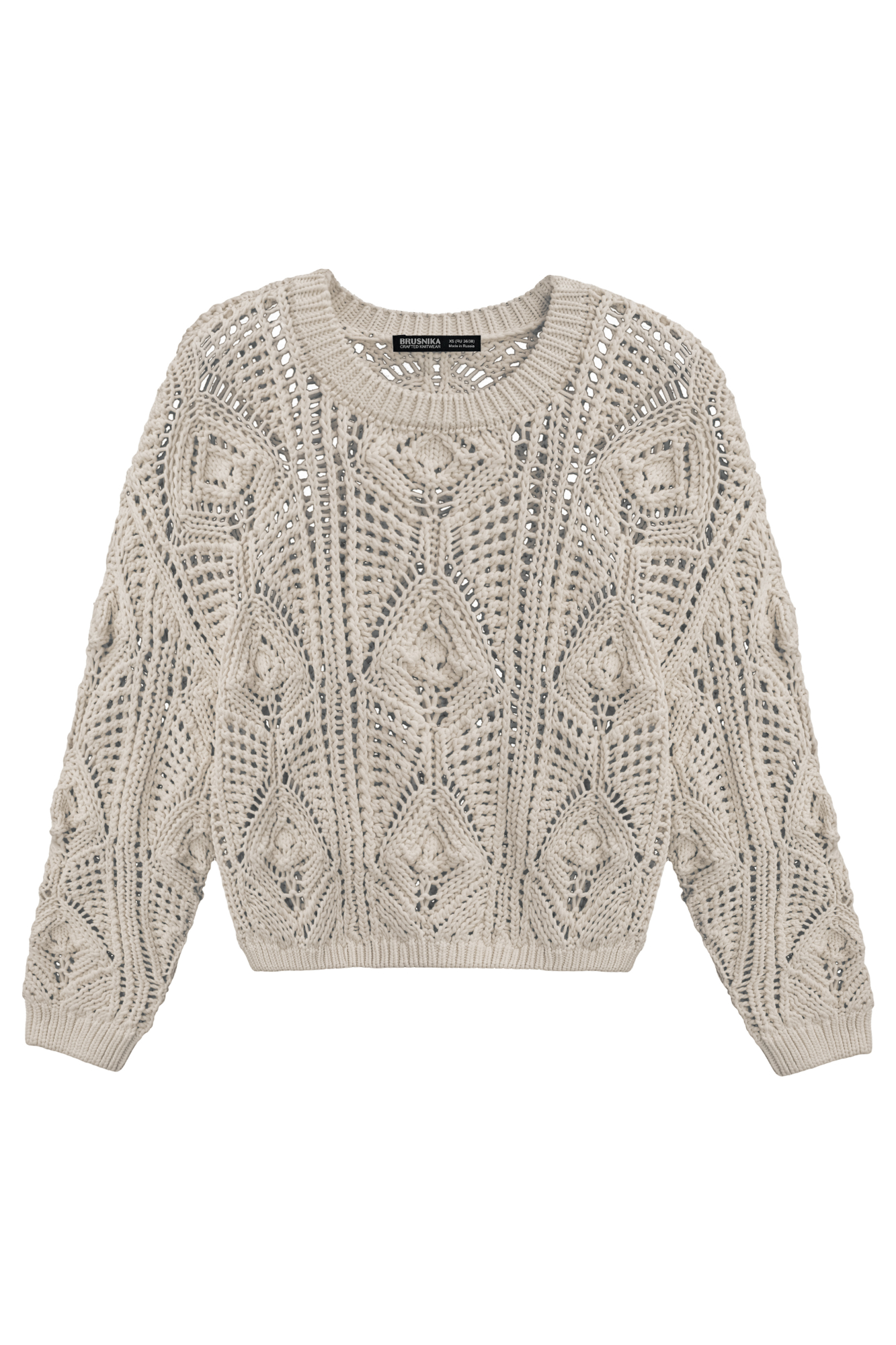 Трикотажный джемпер из хлопка, выполненный ажурной вязкой с орнаментом. Модель свободного силуэта с длинными рукавами и круглым вырезом горловины. Манжеты и низ изделия выполнены в рубчик.