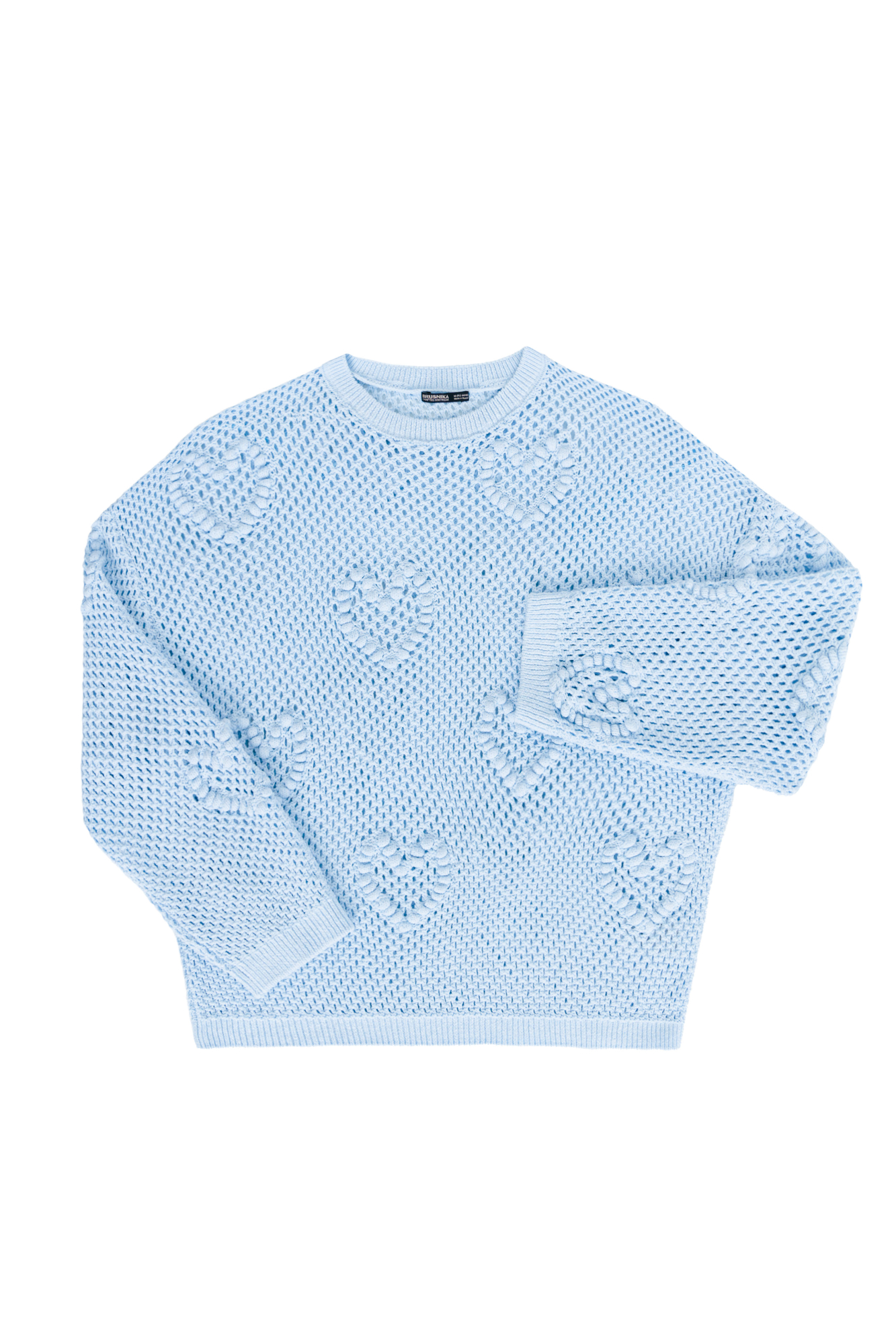 Трикотажный ажурный джемпер из хлопка. Модель свободного силуэта, со спущенной линией плеч, длинными рукавами и круглым вырезом горловины. Изделие декорировано объемными деталями в виде сердечек.