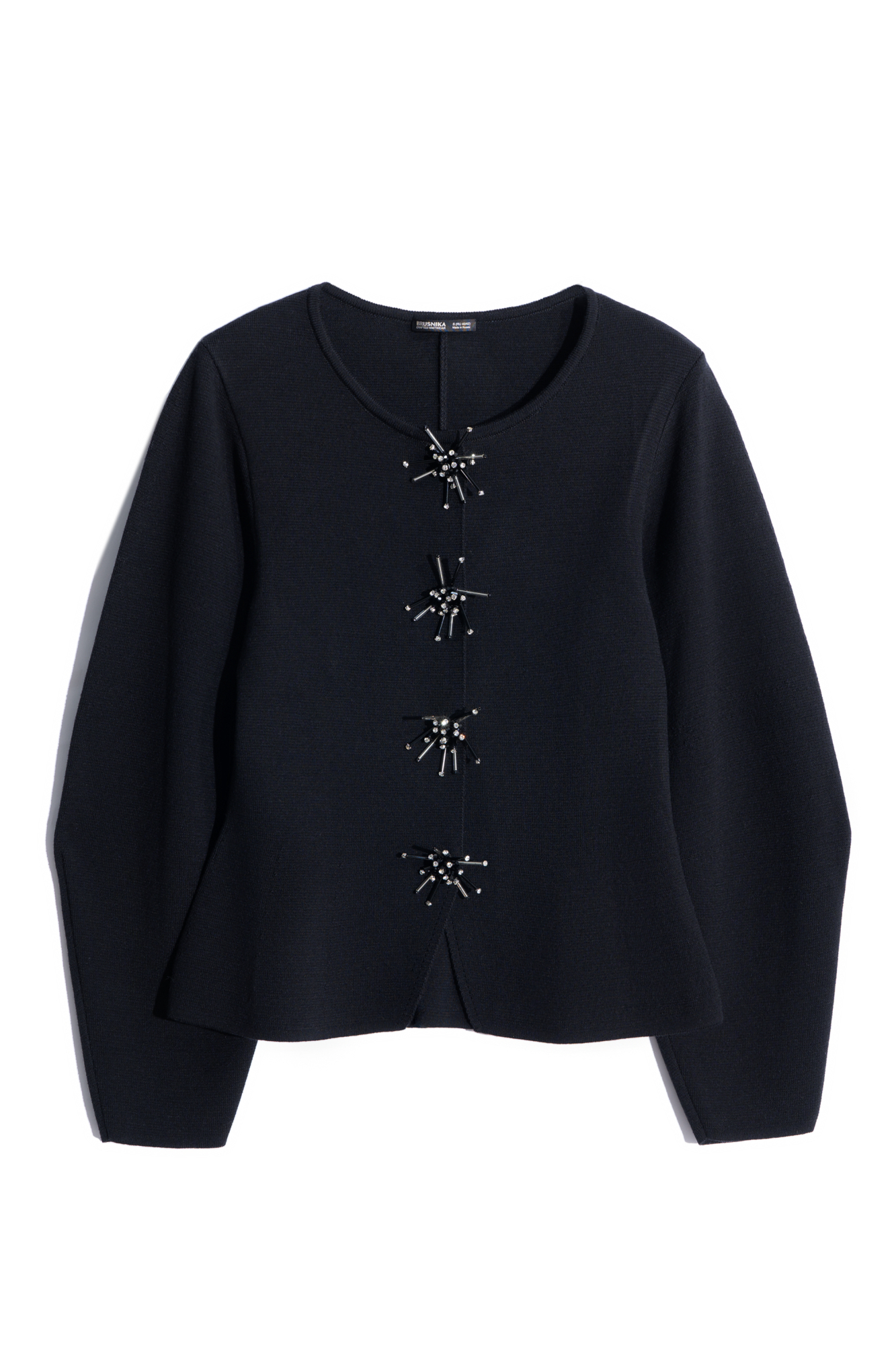 Трикотажный жакет из шерсти. Модель свободного силуэта с широкими рукавами и круглым вырезом горловины без лацканов. Застежка на магнитные кнопки. Изделие декорировано аппликацией из стекляруса и страз.