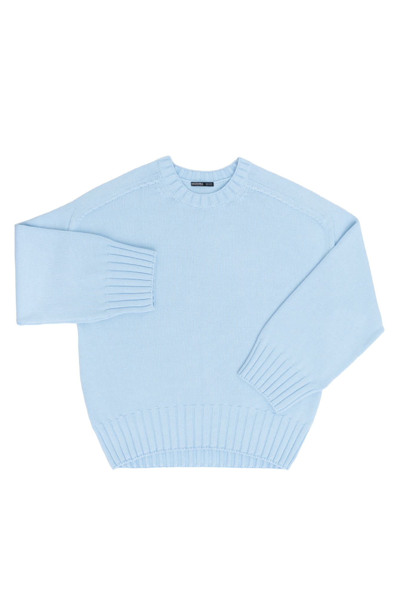 Трикотажный джемпер из 100% хлопка. Модель свободного силуэта со спущенной линией плеча и удлиненной спинкой.