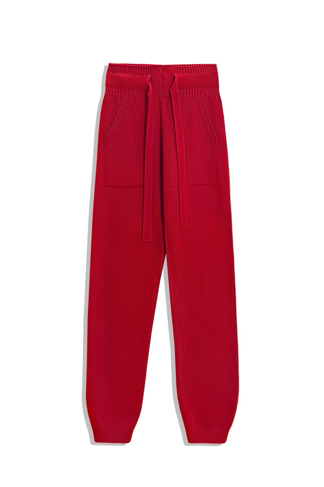 Трикотажные брюки-джоггеры из кашемира и шерсти. Модель с широким эластичным поясом на кулиске, манжетами на резинке и боковыми карманами.