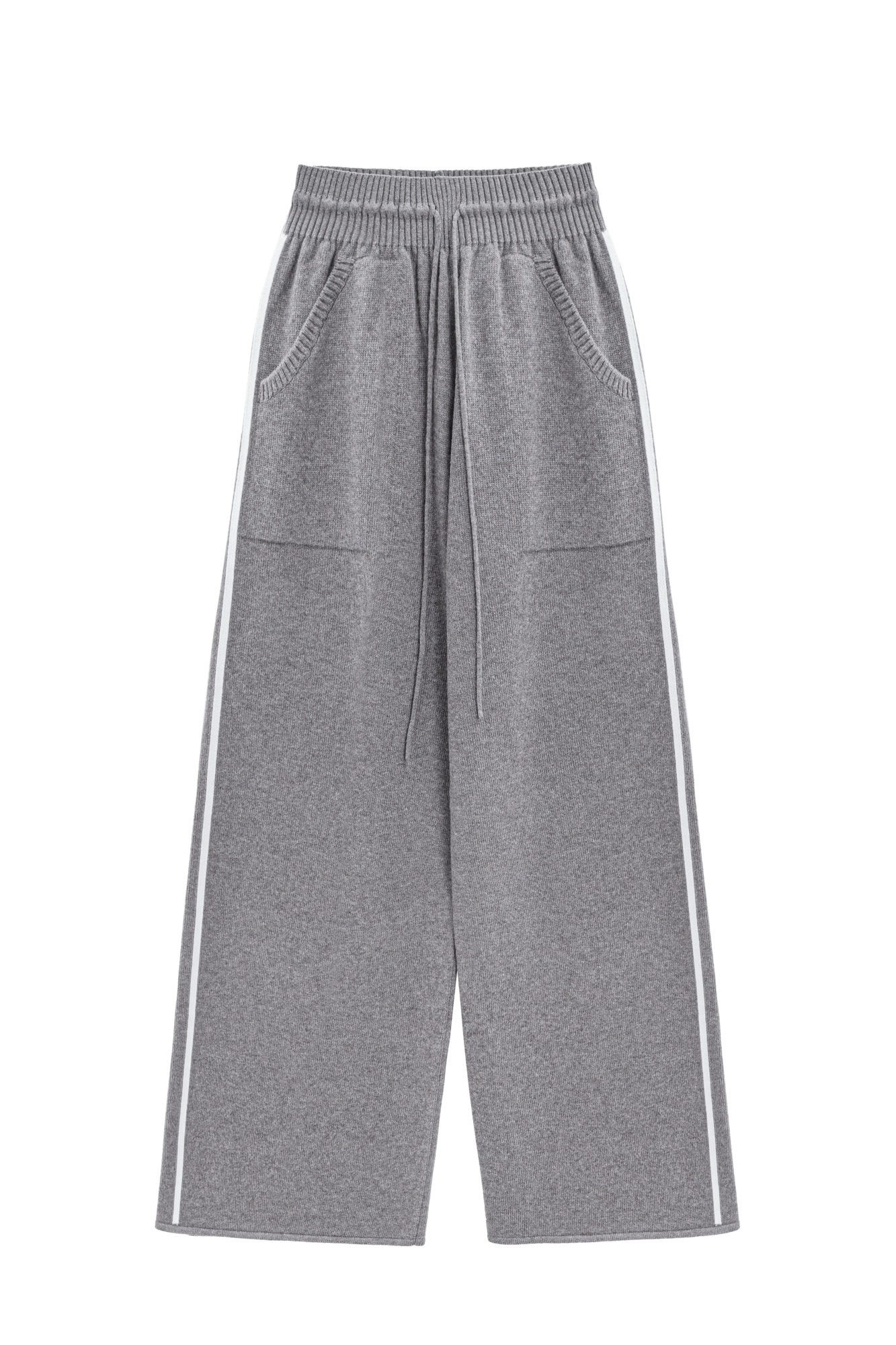 Трикотажные брюки из кашемира и шерсти. Модель свободного силуэта со средней посадкой, боковыми вывязанными карманами и эластичным поясом на кулиске. Изделие декорировано лампасами контрастного цвета.