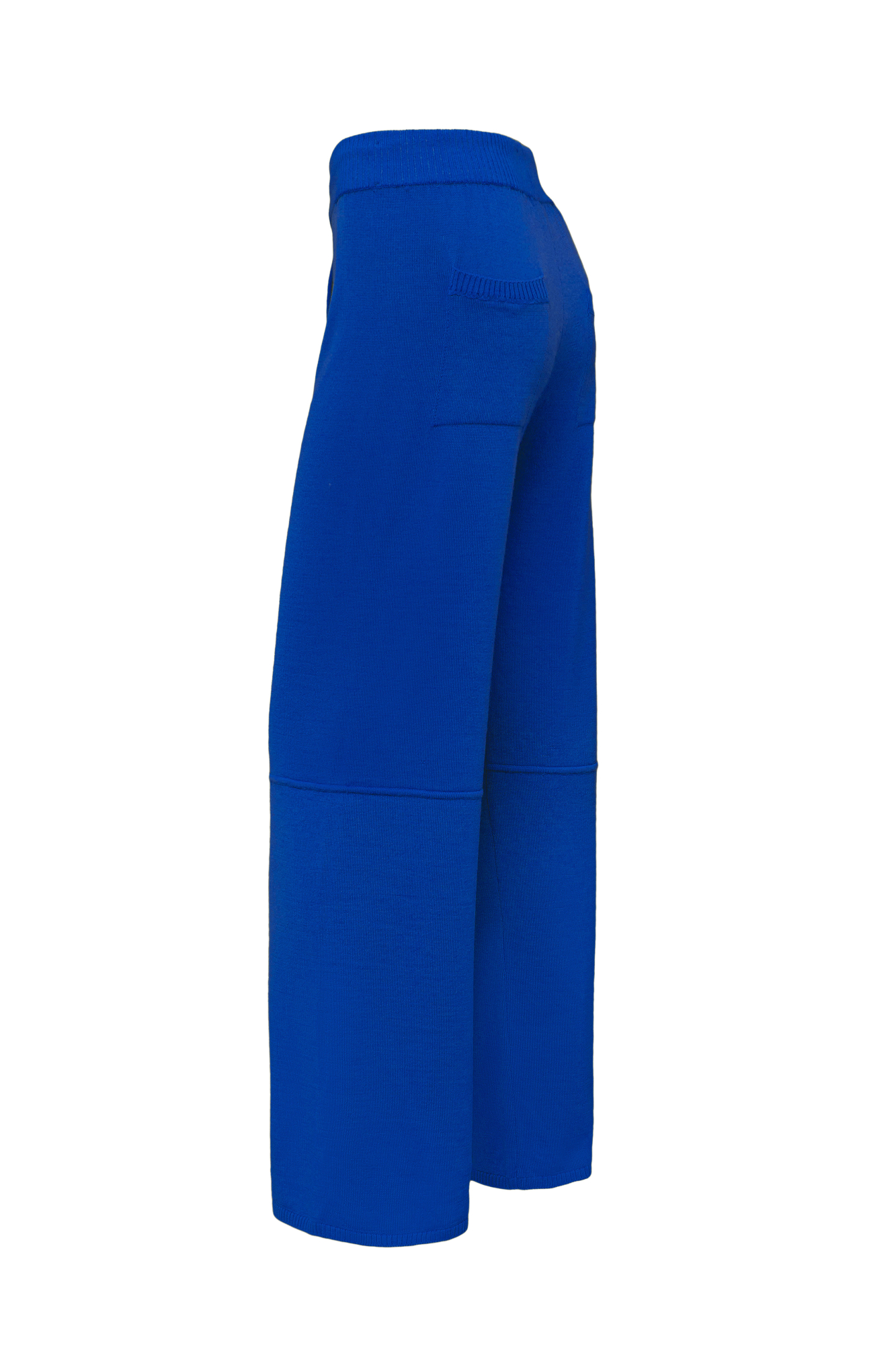 Трикотажные брюки из шерсти. Модель свободного силуэта, со средней посадкой, боковыми и задними карманами и эластичным пояс в рубчик, дополненным тонким шнурком. 