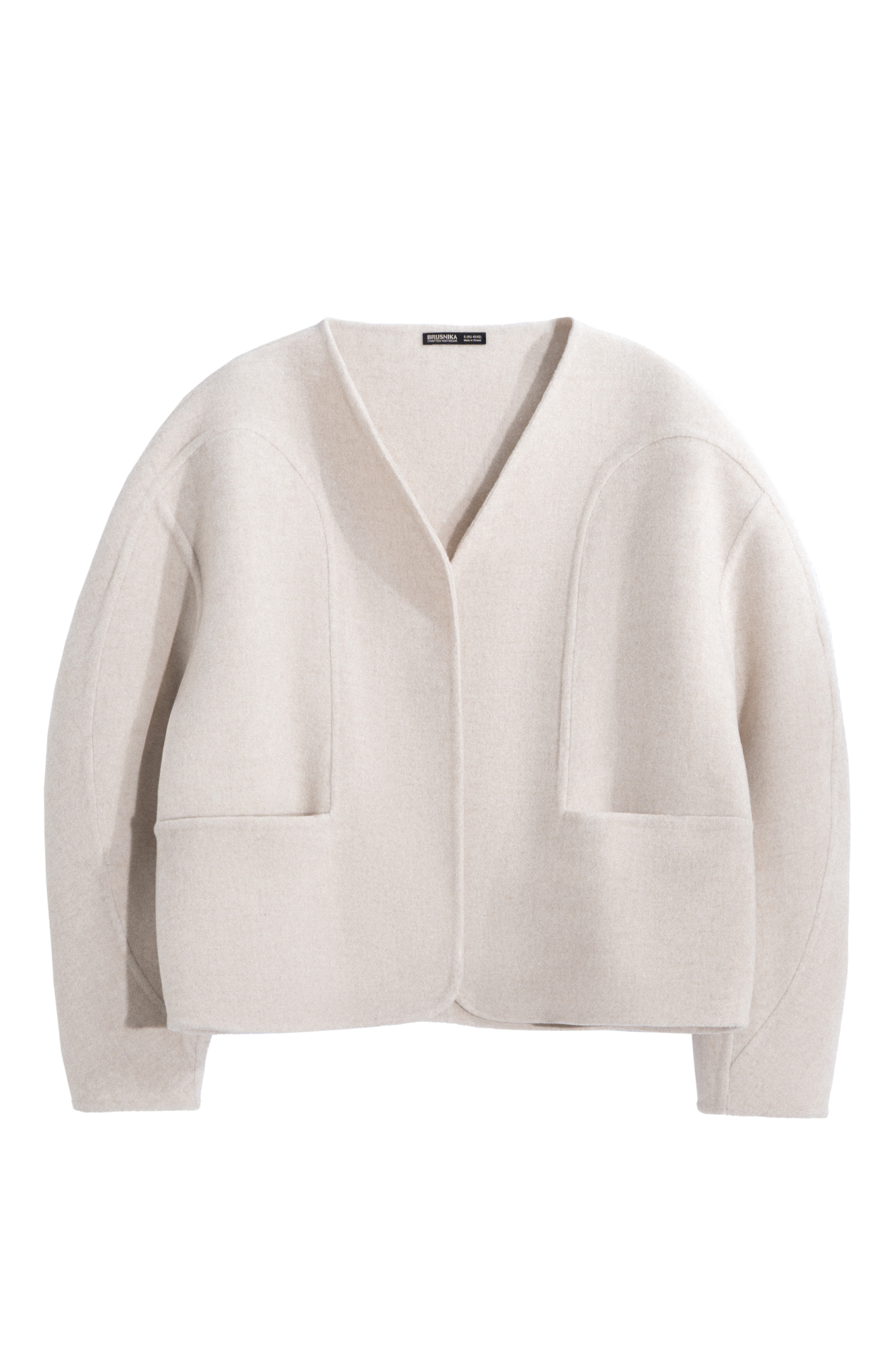 Бомбер из шерстяной ткани. Модель свободного силуэта с круглыми рукавами и глубокими накладными карманами. Изделие без застежки.