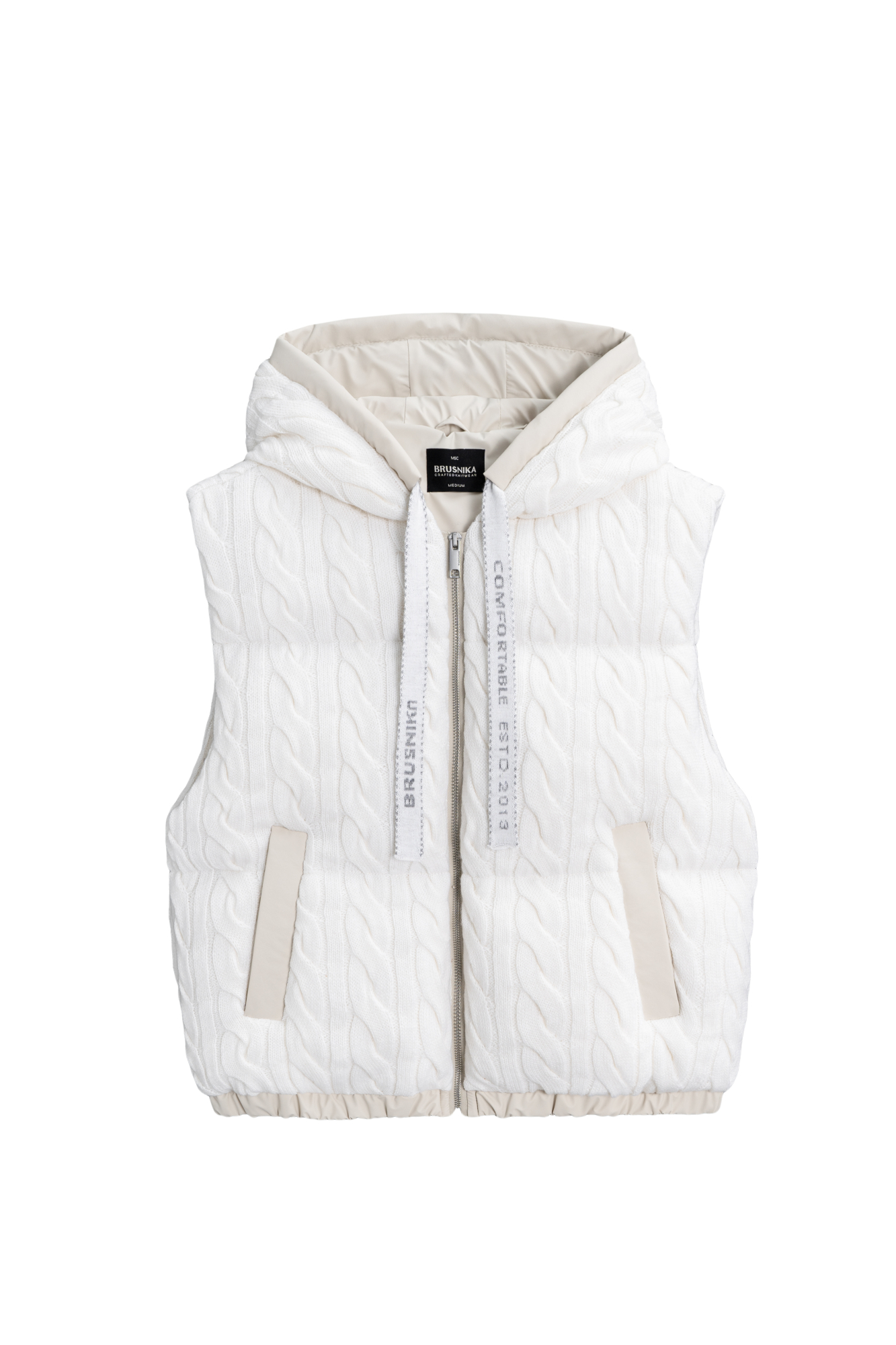 Стеганый жилет на пуху с трикотажным верхом, выполненным объемными косами из мягкой шерсти. Модель прямого кроя, с капюшоном и двумя карманами. Низ изделия выполнен на резинке. На подкладке.