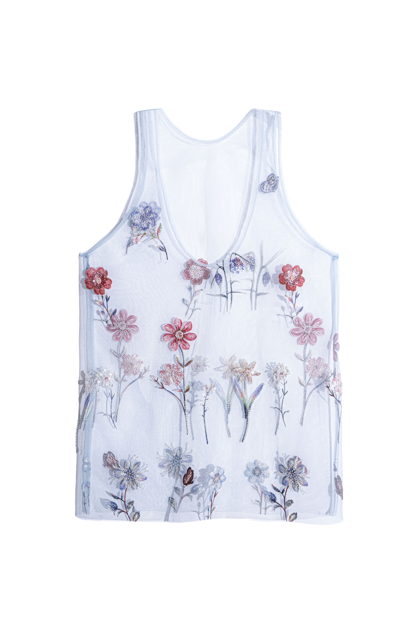 Прозрачный топ с цветочным орнаментом, вышитым пайетками и бисером. Модель без рукавов, с глубоким U-образным вырезом.