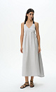 Сарафан из 100% льна длины макси. Модель прямого кроя с акцентным лифом, юбкой А-силуэта и широкими бретелями-лентами контрастного цвета. Вырез на спине.