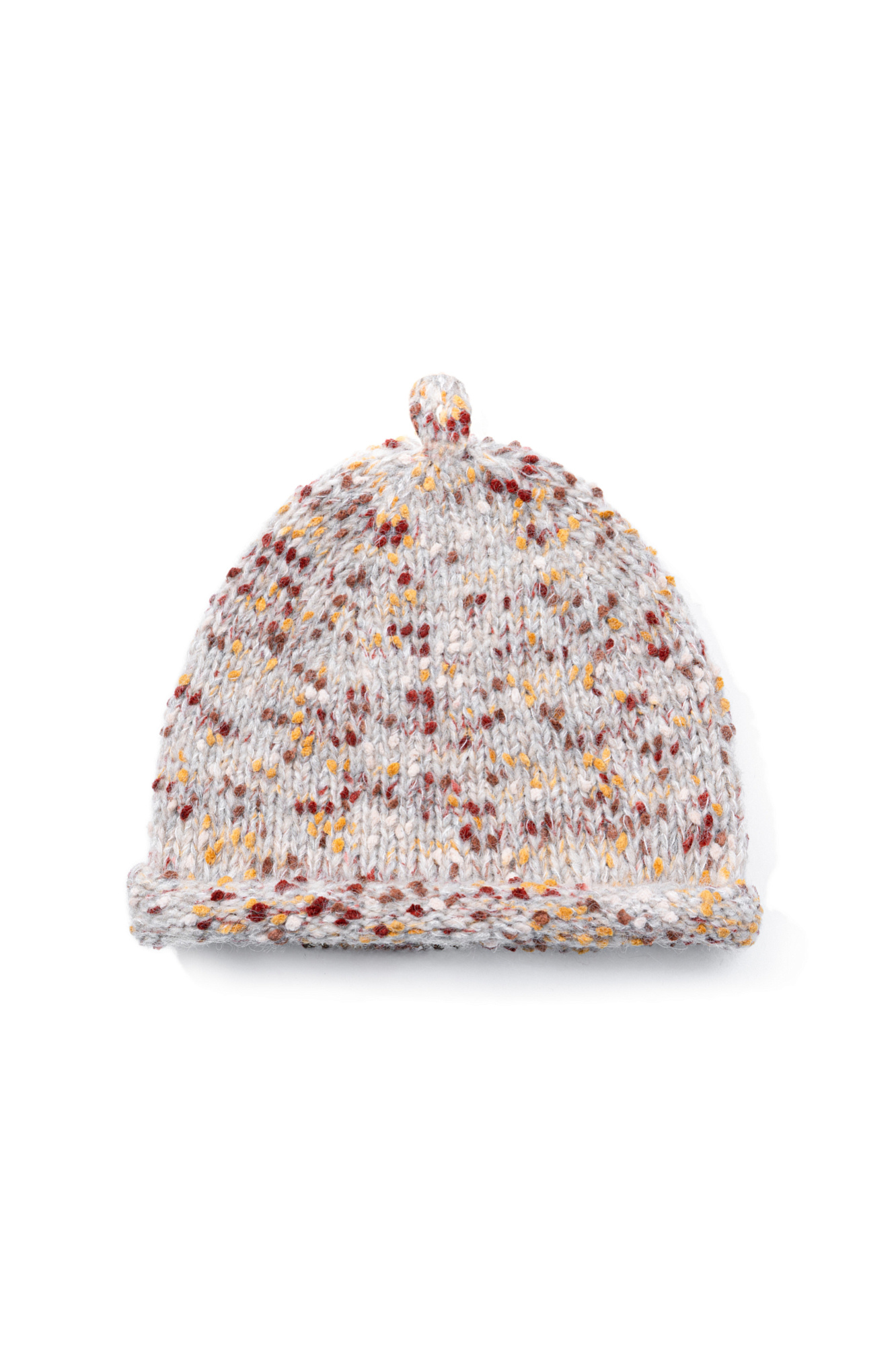 Трикотажная шапка-докер с плотной посадкой по голове и подвернутым краем. Модель из буклированной пряжи с добавлением шерсти альпака.