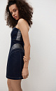 Платье длины мини из денима с металлизированной нитью. Модель по фигуре с корсетным верхом и фигурным вырезом декольте. Изделие выполнено на подкладке с накладками на бедрах для моделирования силуэта "песочные часы". Застежка на молнию сзади.