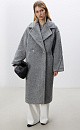 Двубортное пальто из экомеха. Модель прямого силуэта с английским воротником и карманами. Застежка на пуговицу. Изделие на подкладке.