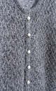 Трикотажный ажурный кардиган из кидмохера, декорированный мелкими пайетками. Модель свободного силуэта с длинными рукавами, круглым вырезом горловины и застежкой на жемчужные пуговицы. 