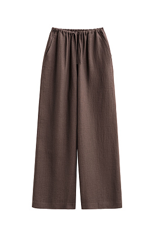 коричневый Широкие брюки из 100% льна. Модель свободного прямого кроя с врезными карманами по бокам. Изделие выполнено с поясом на узкой резинке, дополненным кулиской.