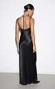 Платье-комбинация длины макси из атласной вискозы. Модель приталенного силуэта, на тонких регулируемых бретельках и высоким вырезом сбоку. Декольте изделия декорировано шифоновыми вставками.