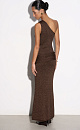 Вечернее платье длины макси из вискозы с люрексом. Модель по фигуре асимметричного кроя. Изделие декорировано широкой перемычкой на плече и драпированной повязкой на бедрах.