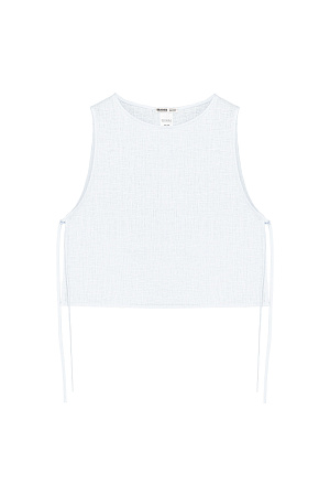 белый Укороченный топ из 100% льна. Модель свободного кроя, без рукавов, с круглым вырезом горловины. Изделие фиксируется завязками по бокам.