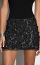 Юбка длины мини с цветочным орнаментом, вышитым пайетками. Застежка на потайную молнию. Изделие на подкладке.