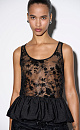 Кружевной топ с цветочным орнаментом, расшитый пайетками. Модель с глубоким U-вырезом на широких бретельках. Изделие декорировано баской.
