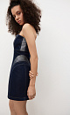 Платье длины мини из денима с металлизированной нитью. Модель по фигуре с корсетным верхом и фигурным вырезом декольте. Изделие выполнено на подкладке с накладками на бедрах для моделирования силуэта "песочные часы". Застежка на молнию сзади.
