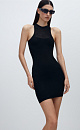 Трикотажное платье из вискозы длины мини. Модель по фигуре с неглубоким вырезом горловины, американской проймой и открытыми плечами. Изделие декорировано вставкой из сетки на груди.
