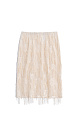 Юбка длины миди с геометрическим орнаментом, вышитым прозрачными пайетками. Модель декорирована россыпью пайеток и бахромой на подоле. Изделие выполнено без подкладки.