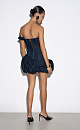 Платье длины мини из хлопка с добавлением металлизированной нити. Модель с корсетным верхом, фигурным лифом, асимметричным рукавом и объемной юбкой-баллон. Застежка на молнию сзади.