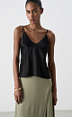 Атласный топ из тонкой вискозы. Модель прямого кроя, на тонких бретелях и глубоким V-образным вырезом.