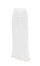 Трикотажная юбка длины макси на эластичном поясе с кулиской. Модель декорирована тесьмой с крупными бусинами. Дополнить образ можно джемпером в таком же стиле.