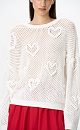 Трикотажный ажурный джемпер из хлопка. Модель свободного силуэта, со спущенной линией плеч, длинными рукавами и круглым вырезом горловины. Изделие декорировано объемными деталями в виде сердечек.