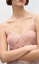 Топ из тонкого кружева. Модель с треугольным лифом, на регулируемых бретельках. Изделие выполнено без подкладки.