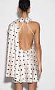Атласное платье длины мини с принтом в горох. Модель по фигуре с вырезом халтер, застежкой на шее на пуговицы, открытой спинкой и тонкими регулируемыми бретельками. Изделие декорировано длинным шарфом.