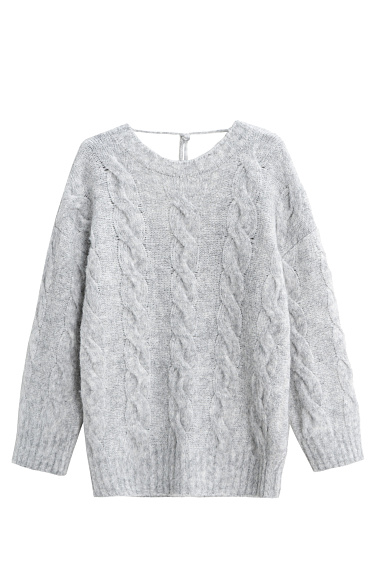 Трикотажный джемпер с открытой спиной и косами