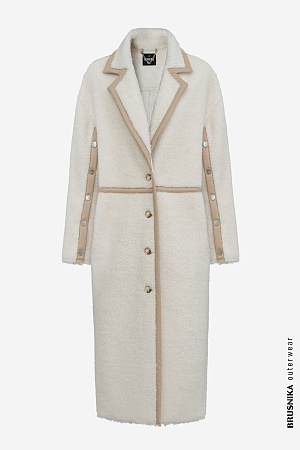 молочный Пальто из натуральной шерсти. Модель прямого силуэта с английским воротником, боковыми карманами и декоративными элементами из экокожи. Рукава изделия выполнены на кнопках.