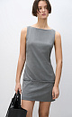 Платье-футляр длины мини из шерсти. Модель прямого кроя, без рукавов, с вырезом-лодочкой. Изделие декорировано шлевками и тонким ремешком на бедрах. Застежка на молнию сзади.