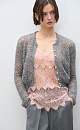 Трикотажный ажурный кардиган из кидмохера, декорированный мелкими пайетками. Модель свободного силуэта с длинными рукавами, круглым вырезом горловины и застежкой на жемчужные пуговицы. 