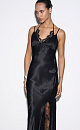 Платье-комбинация длины макси из атласной вискозы. Модель приталенного силуэта, на тонких регулируемых бретельках и высоким вырезом сбоку. Декольте изделия декорировано шифоновыми вставками.