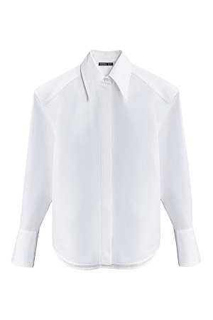 белый Рубашка из хлопка. Модель прямого кроя, с длинными рукавами с манжетами, классическим отложным воротником, увеличенными плечами и завязкой на спинке. Застежка на пуговицы под планкой. 