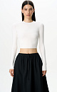 Трикотажный кроп-топ из вискозы с длинным рукавом, круглым вырезом горловины и фигурным низом. Края изделия выполнены в рубчик.
