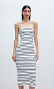 Трикотажное платье длины миди из вискозы в рубчик. Модель приталенного силуэта, на тонких бретельках и разрезом сзади.