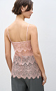 Топ из тонкого кружева. Модель с треугольным лифом, на регулируемых бретельках. Изделие выполнено без подкладки.